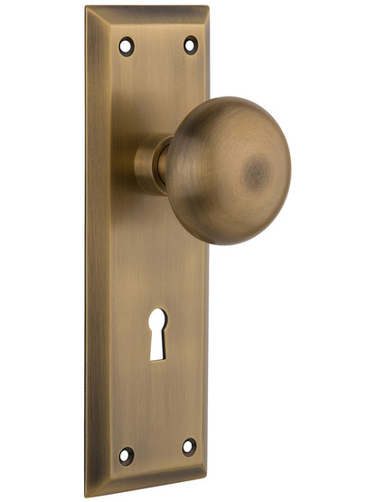 New York Style Door Set With Classic Round Knobs in Antique Brass.